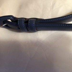 A navy leather women’s belt.